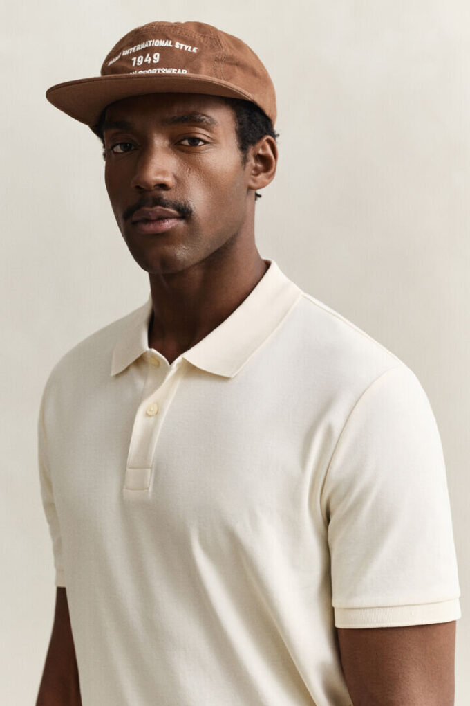 Camisa polo em malha interlock