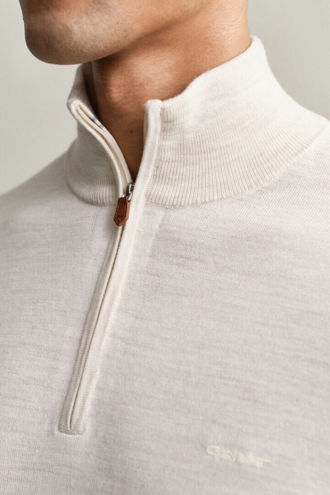 Camisola com meio fecho em lã merino extra fina