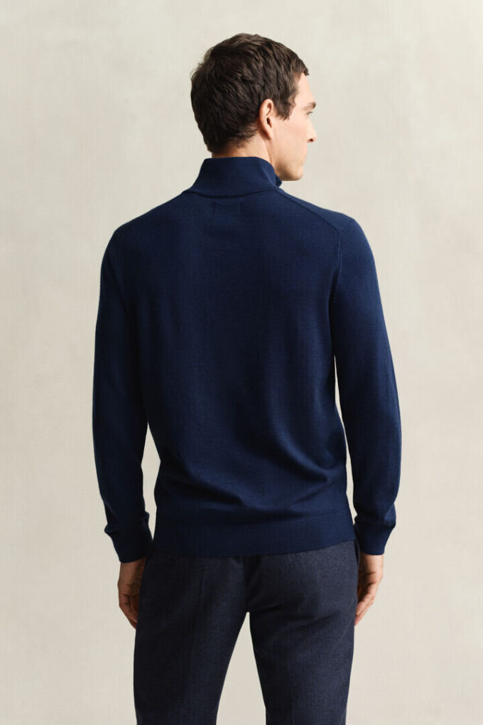 Camisola com meio fecho em lã merino extra fina