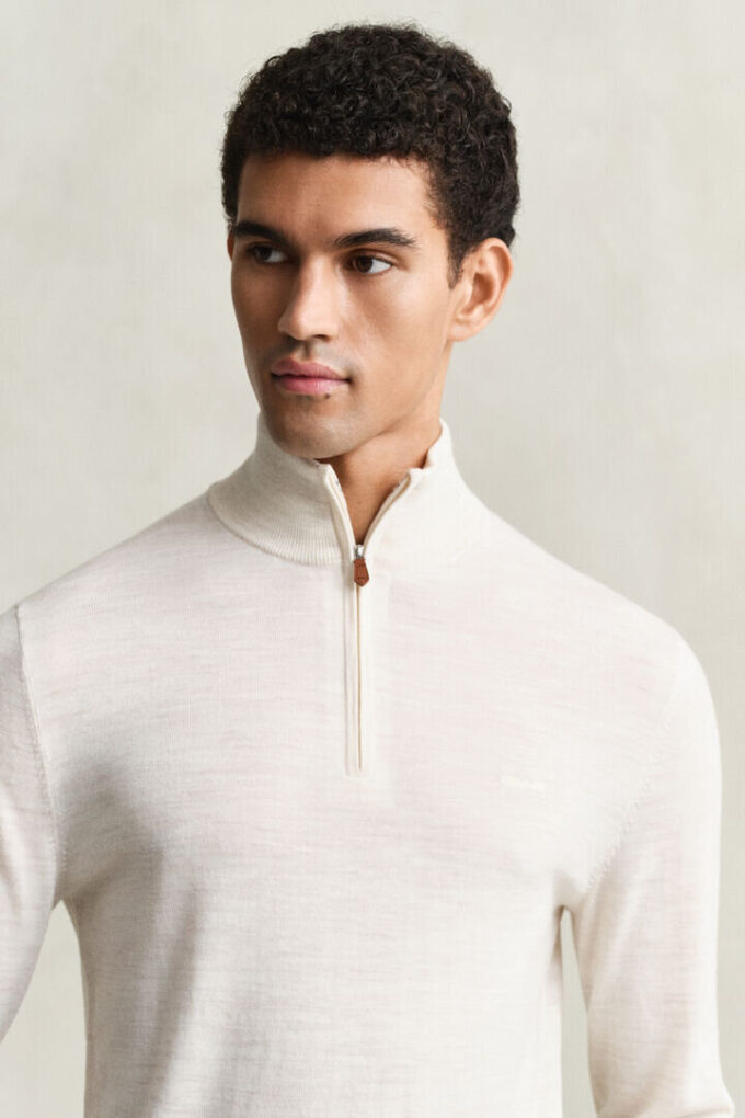 Camisola com meio fecho em lã merino extra fina