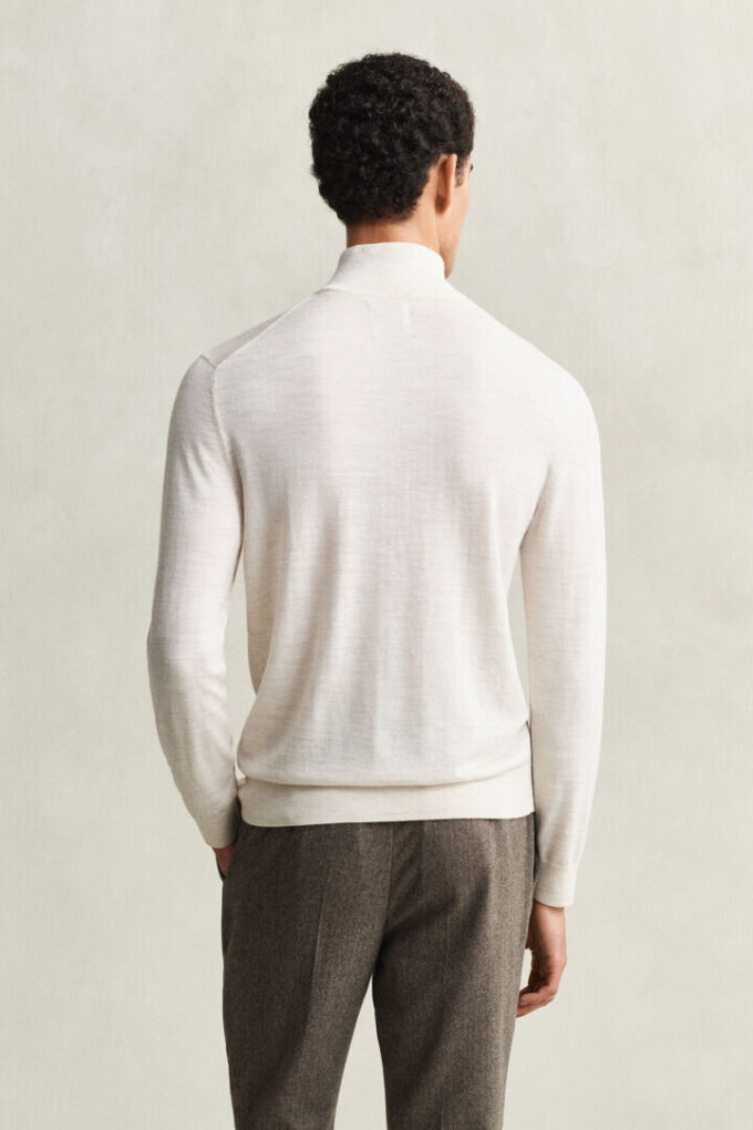 Camisola com meio fecho em lã merino extra fina
